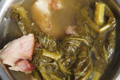 Indian/Mizo Food: Soup made of Smoked and cured pork (Vawksa Rep) with green cabbage leaves