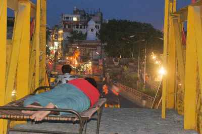 Indian sleeping on foot-over bridge in Amritsar, Punjab (India)