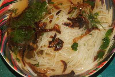Bangladeshi/Marma food: Chicken broth with rice noodles, fried onions and cilantro leaves