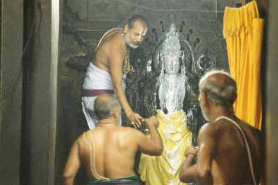 Preparing Krishna for Darshan, at Kappe Chenniga-raya Devalaya Temple, Beluru, Karnataka (India)