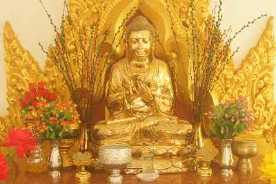 Golden buddha statue in Great Holyland Monastery (Burmese Buddhism), in Bodhgaya, Bihar (Northern India)