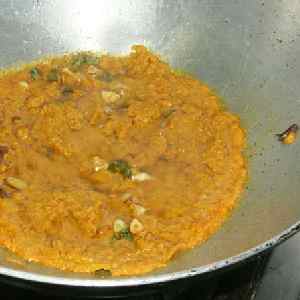 Indian Food: Bharta. Phase Four: Quench with tomatoes, pureé and add aubergine (not shown)