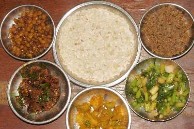 Newari Food in Kathmandu (Nepal): Chana (chickpea), Choila (marinated buffalo), Alu (potato), Lasun Motar Kosa (raw garlic green), Kochila (fried ground buffalo) with beaten rice