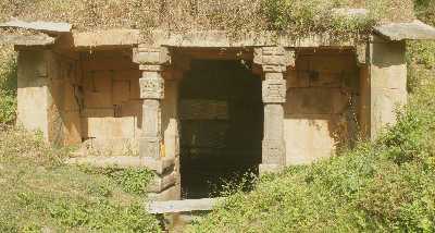 Hindu stone temple with a water basin (kund) inside at Ajmerkot (Ajaimerukot) near Dadeldhura, Western Nepal