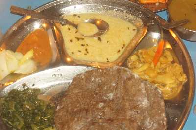 Nepali Food: Vegetarian food with millet bread (kodo roti) 