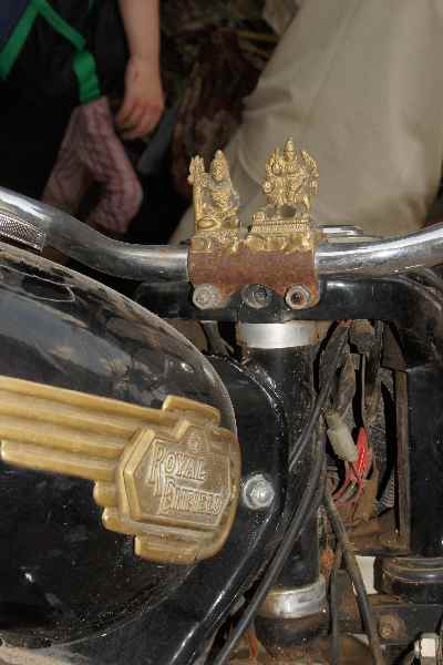 Shiva and Parvati idols mounted on an Royal Ensfield motorcycle, New Delhi, India