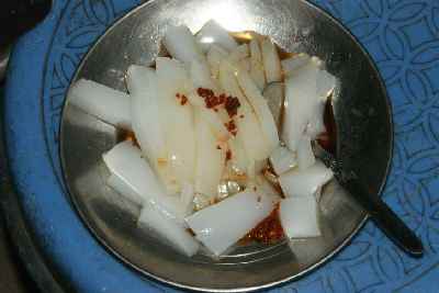 Indian / Tibetan food: La fing (Phing), Bean jelly cut into stripes and dressend with garlic, soy sauce, chili
