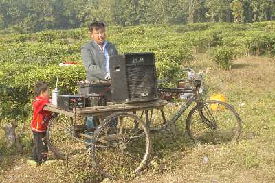 Party with portable music in a Tea garden near Kakarvitta (Nepal)