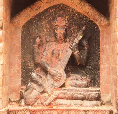 Hindu goddess Saraswati, stone carving, in Dhulikhel, Kathmandu Valley, Nepal