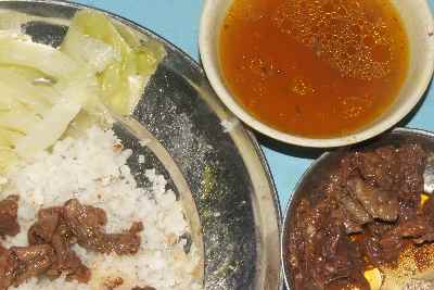 Indian / Naga food: Fried pork innards with rice, cabbage and broth