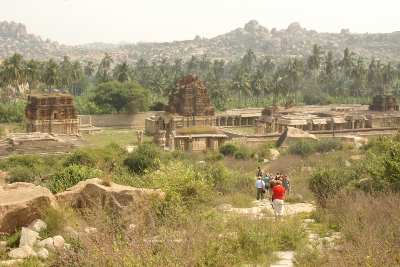 Tourist group approaching the Achutaraya Devalaya temple at Hampi (former Vijaranagara), Karnataka (India)
