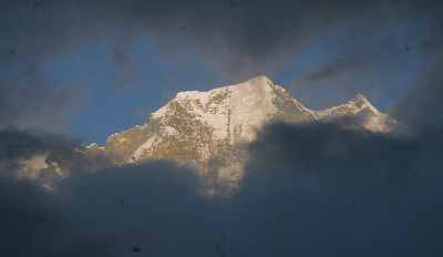 Nilgiri peak seen through a window in the clouds in Kalopani (Mustang, Nepal)