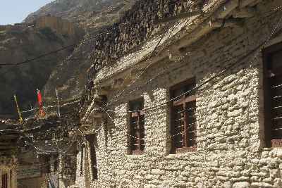 House with firewood stored on the rooftop in Marpha (Mustang, Nepal)