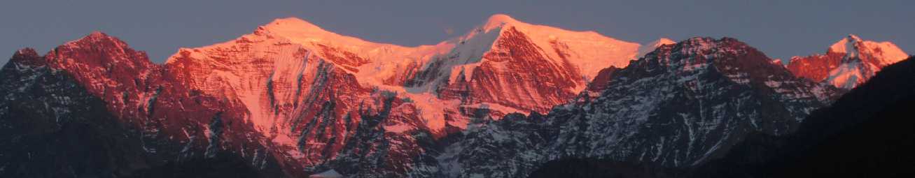 Nilgiri mountains in the Himalayas, seen from Tukuche (Nepal), appearing almost pink in evening glow