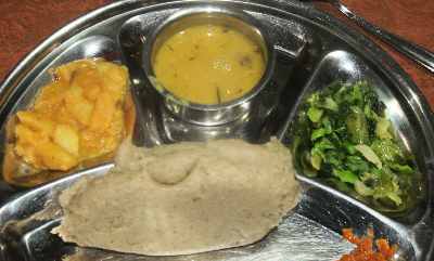 Nepalese/Thakali Food: Phapar ko Diro (stiff buckwheat porridge) with boiled vegetables and pickles 