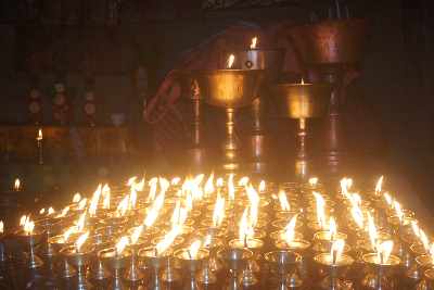 Butter lamps in Narsang Gompa buddhist monastery in Kobang, Mustang, Nepal