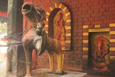 Bronze Lion guarding entrance to Kalika Mandir Hindu Temple in Baglung, Nepal