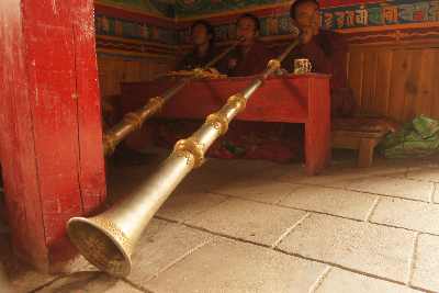 Tibetan (mugumpa) buddhist monks blowing horns in Jumla, Western Nepal