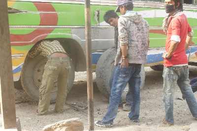 One more tire change in Tallo Dungeshwar, Karnali Highway (Himalaya, Western Nepal)