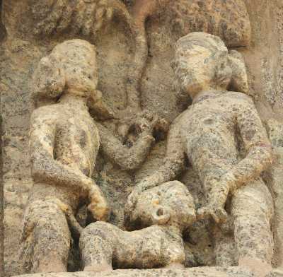 Erotic stone carving showing threesome at Sun Temple Surya Mandir, in Konark, Orissa (India)