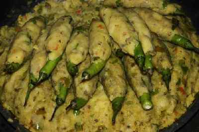 Rajasthani/Indian Food: Preparing Chili Pakora (Mirch Pakora): Coating Chiles with spiced potato mash