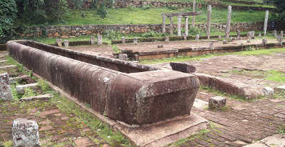 Monks' refectoctory with stone trough for food offerings, in Mihintale (Cultural Triangle), Sri Lanka
