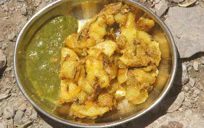 North Indian Food: Alu Jeera (Roast potato with Cumin) servd with mint chutney 