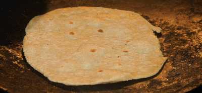 North Indian Food: Indian bread Chapati baked on a hot surface 