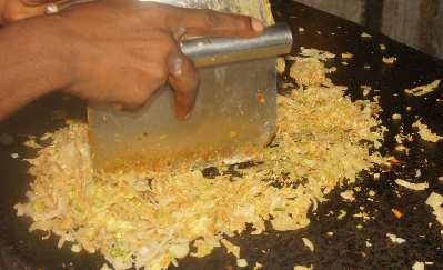 Sri Lankan Food: Kottu Roti (egg, vegetables and bread flakes prepared on a hot plate