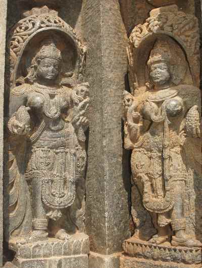 Pair of statues holding fake maize (corn cobs, Zea mays), at Hoysala-style Keshava Devalaya Temple, Somnathpur, near Mysore, Karnataka, India