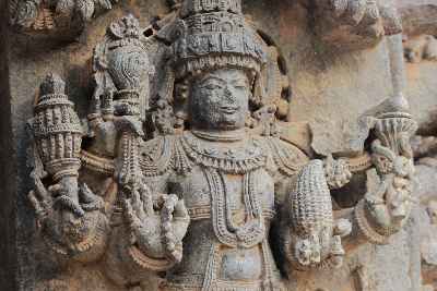 Statue of god Vishnu holding fake corn cob (maize, Zea mays), Keshava Devalaya Temple, Somnathpur, Karnataka, India