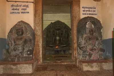Idol and protective Yakshas in Shasana Basti Jain temple, Chandragiri hill, Sravanabelagola, Karnataka (India)