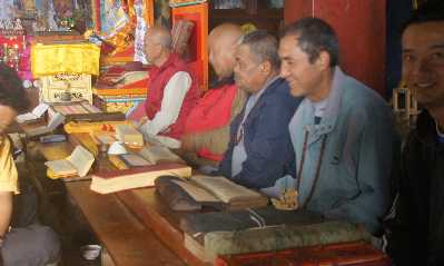 Recitation from the Tibetan Book of Deads during Buddhist Puja temple ceremony in Tarkeghyang, Helambu, Nepal