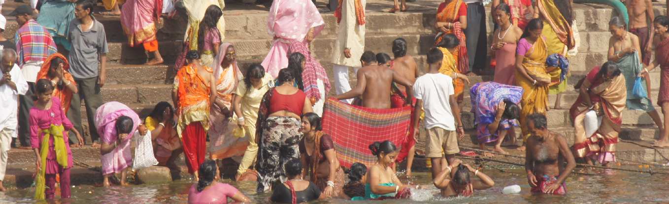 Hindus bathing in the Ganga river at Dr. Rajendra Prasad Ghat (near Main Ghat), Varanasi, Uttar Pradesh, India
