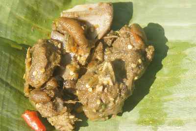 Cooked dog in Rongbang near Williamnagar, East Garo Hills (Meghalaya, North Eastern India)